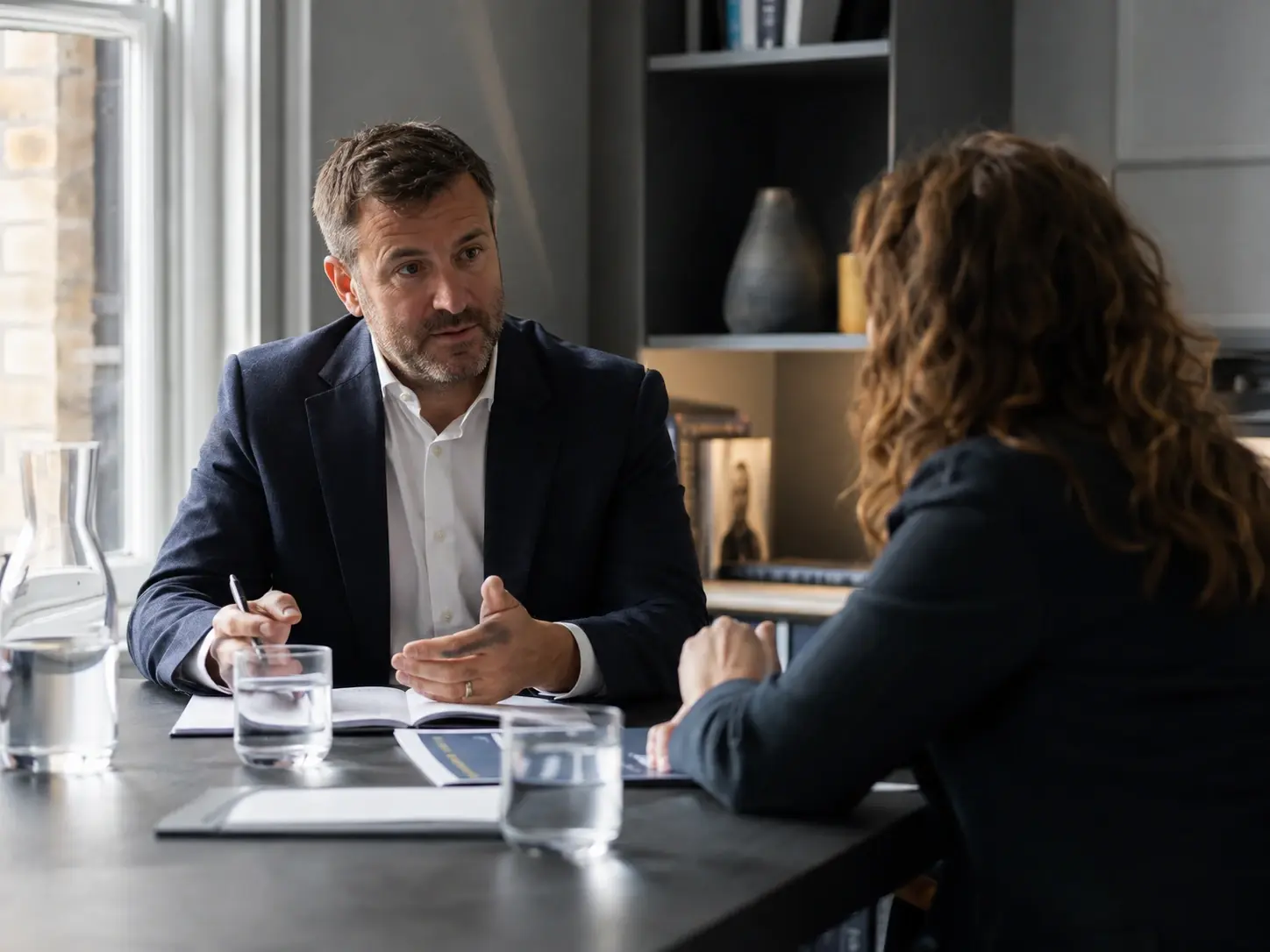 Consultant speaking with a business owner during an initial consultation